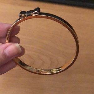 Kate Spade blank and gold bow tie bangle